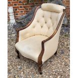 A VICTORIAN MAHOGANY TUB NURSING ARMCHAIR With cushioned headrest and button back upholstery on