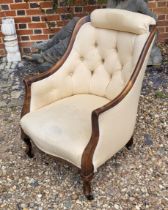 A VICTORIAN MAHOGANY TUB NURSING ARMCHAIR With cushioned headrest and button back upholstery on