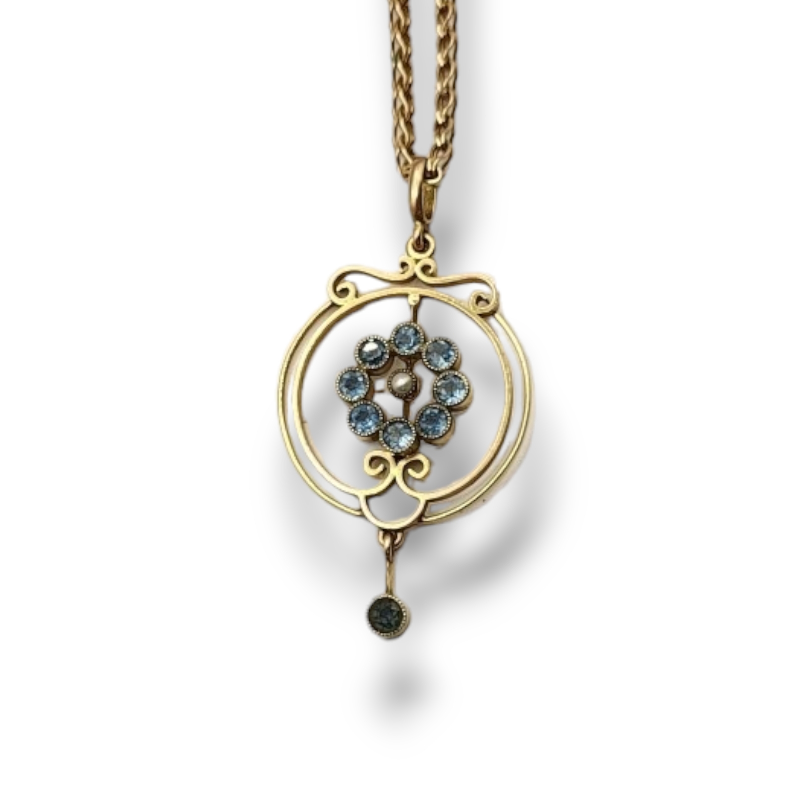 AN EARLY 20TH CENTURY 9CT GOLD AND AQUAMARINE AND SEED PEARL PENDANT NECKLACE The central pearl