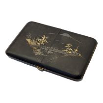 AN EARLY 20TH CENTURY JAPANESE BLACK DAMASCENE CIGARETTE CASE Inlaid with 24ct gold decoration