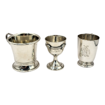 AN EDWARDIAN WALKER & HALL NOVELTY SILVER 1/3 PINT MEASURE CUP Sheffield, 1905, along with a