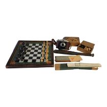 A LATE VICTORIAN REVERSE GLASS CHESS BOARD Hand painted with green border and outer frame,