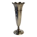 AN EARLY 20TH CENTURY SILVER TRUMPET VASE Having a scrolled flared rim with reeded design on