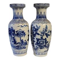 A PAIR OF 20TH CENTURY CHINESE BLUE AND WHITE BALUSTER FORM PORCELAIN VASES Flora and fauna pattern,