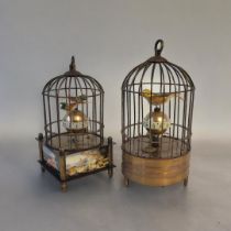 AN AUTOMATED BIRDCAGE CLOCK Having two feathered birds perched on a rotating central movement and