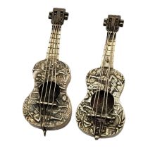 A PAIR OF EARLY 20TH CENTURY DUTCH SILVER NOVELTY GUITARS Having embossed figural decoration. (
