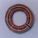 AN AFRICAN TRIBAL MAASAI BEADWORK COLLAR The arrangement of colourful glass beads forming concentric