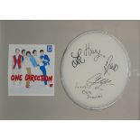 ONE DIRECTION, AN ORIGINAL AUTOGRAPHED DRUM SKIN Signed by Harry Styles and all members, in a fitted
