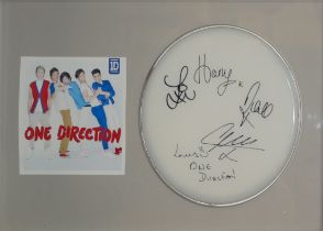 ONE DIRECTION, AN ORIGINAL AUTOGRAPHED DRUM SKIN Signed by Harry Styles and all members, in a fitted