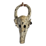 A 20TH CENTIRY AFRICAN TRIBAL CARVED WOODEN 'BOZO' MASK Horseshoe form horns, with elongated