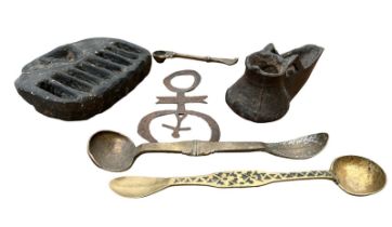 A COLLECTION OF SOUTH AMERICAN BRASS AND METAL UTENSILS To include two double spoons and cast iron