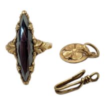 A CONTINENTAL 10CT GOLD AND HEMATITE RING Marquis cut stone in a scrolled mount, together with a