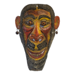 A VINTAGE CONTINENTAL PAINTED METAL CEREMONIAL MASK Pierced features, hand painted with red,