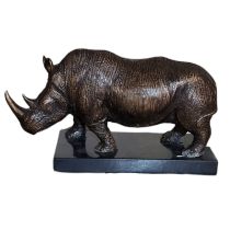 A CONTEMPORARY BRONZE RHINO STATUE Standing pose with engraved decoration on black marble base. (