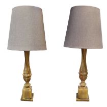 A PAIR OF 20TH CENTURY ONYX LAMPS Carved baluster form with stepped square base and grey fabric