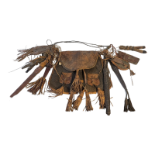 A VINTAGE AFRICAN TRIBAL LEATHER 'DOGON' WITCH DOCTOR BAG Having hanging tassels and leather clad