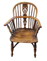 A 19TH CENTURY YEW AND ELM WINDSOR CHAIR Pierced splat, solid saddle seat, on turned legs with