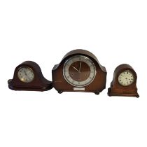 AN EDWARDIAN MAHOGANY INLAID MANTEL CLOCK The white enamel dial painted with Roman numerals, eight