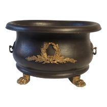 AN EARLY 20TH CENTURY EMPIRE STYLE METAL BLACK PATINATED TUREEN SHAPE TWIN HANDLED URN/JARDINIERE