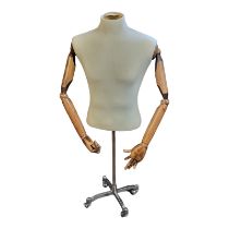 A VINTAGE TAILOR’S DUMMY With calico covered, body wooden articulated arms, on chrome base. (130cm)