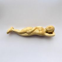 A 19TH CENTURY CHINESE STYLE BONE DOCTORS FIGURE Nude woman lying in recumbent position. (13cm)