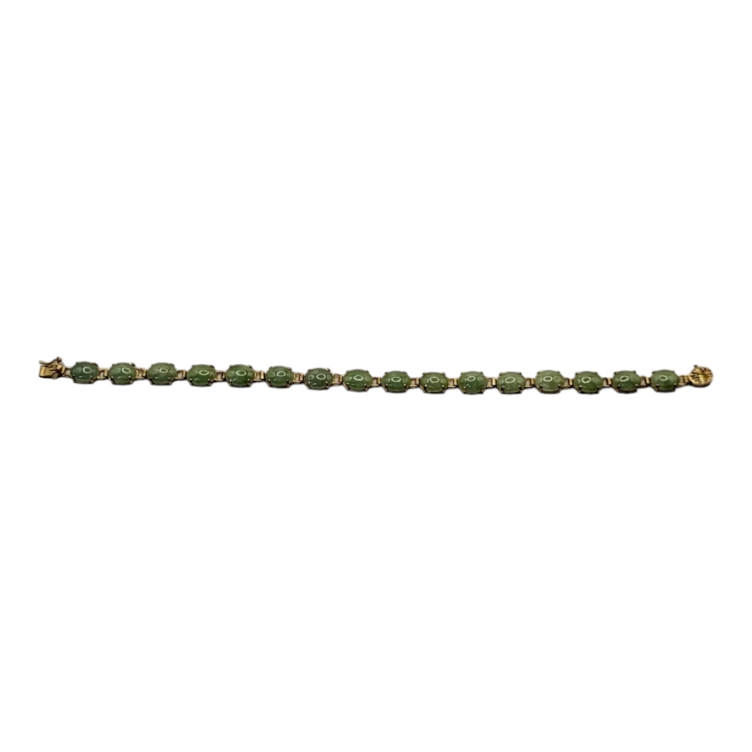 A VINTAGE CHINESE 14CT GOLD AND JADE BRACELET Having a row of cabochon cut stones with a pierced