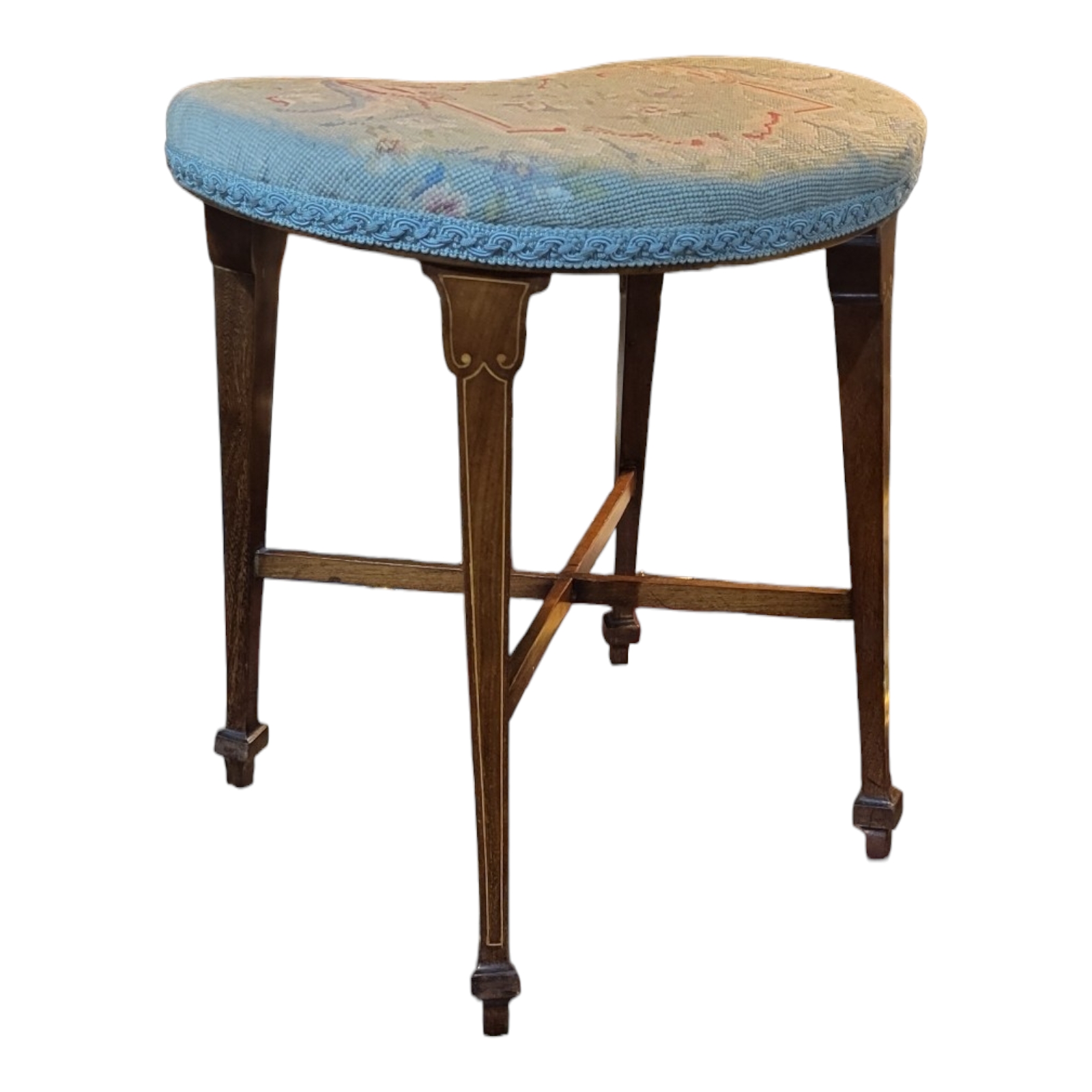AN EDWARDIAN SHERATON REVIVAL INLAID MAHOGANY STOOL Raised on tapering legs and x shaped supports,