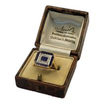 A CONTINENTAL 14CT GOLD, DIAMOND AND LAPIS LAZULI RING Having a row of round cut diamonds edged with