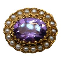 A VICTORIAN STYLE 9CT GOLD, AMETHYST AND PEARL OVAL BROOCH Having central oval cut amethyst (