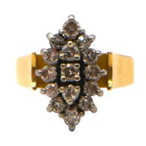 AN 18CT GOLD, PALLADIUM AND DIAMOND MARQUISE SHAPED RING Having a halo of twelve brilliant and round