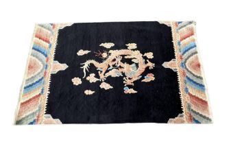 CHINESE CIRCA 1880, WOOL PILE, COTTON FOUNDATION CARPET/RUG decorated with dragon. (210 x 127cm)