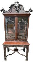 MANNER OF THOMAS CHIPPENDALE, A 19TH CENTURY CHINESE CHIPPENDALE CARVED MAHOGANY DISPLAY CABINET
