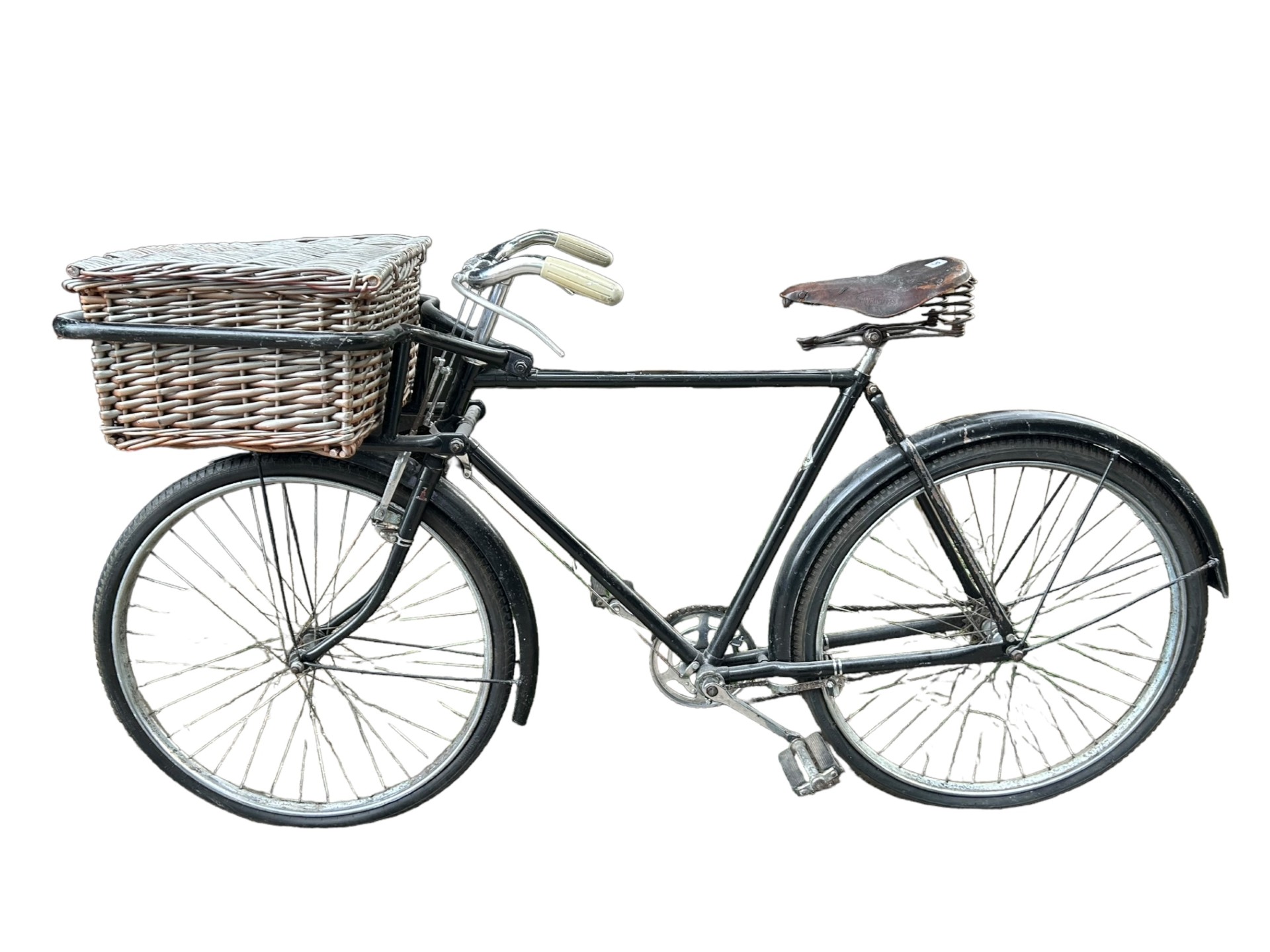 A VINTAGE RALEIGH BUTCHER’S BICYCLE With rod brakes and wicker basket.