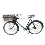 A VINTAGE RALEIGH BUTCHER’S BICYCLE With rod brakes and wicker basket.