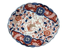 A LATE 19TH CENTURY JAPANESE IMARI CHARGER/DISH Decorated with Fo dog and ball, flowers, foliage