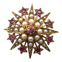 A VINTAGE 9CT GOLD, PINK TOPAZ AND PEARL STAR BROOCH Having twenty-four graduated cabochon cut