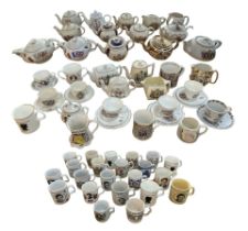 A LARGE COLLECTION OF LATE 19TH/20TH CENTURY COMMEMORATIVE PORCELAIN Comprising teapots, cups and