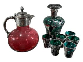 A LATE 19TH/EARLY 20TH CENTURY SILVER PLATED AND CRANBERRY GLASS WATER EWER Together with 20th