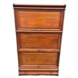 AN EARLY 20TH CENTURY MAHOGANY GLOBE WERNICKE DESIGN THREE SECTION BOOKCASE With paneled doors above
