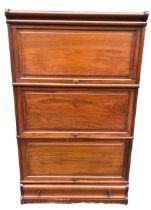 AN EARLY 20TH CENTURY MAHOGANY GLOBE WERNICKE DESIGN THREE SECTION BOOKCASE With paneled doors above