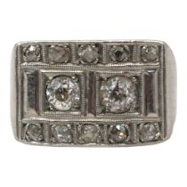 AN ART DECO WHITE METAL AND DIAMOND RING (WHITE METAL TESTS AS PLATINUM) Having two round old