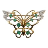 A 9CT GOLD, EMERALD AND DIAMOND BUTTERFLY BROOCH Having eight graduated claw set round cut