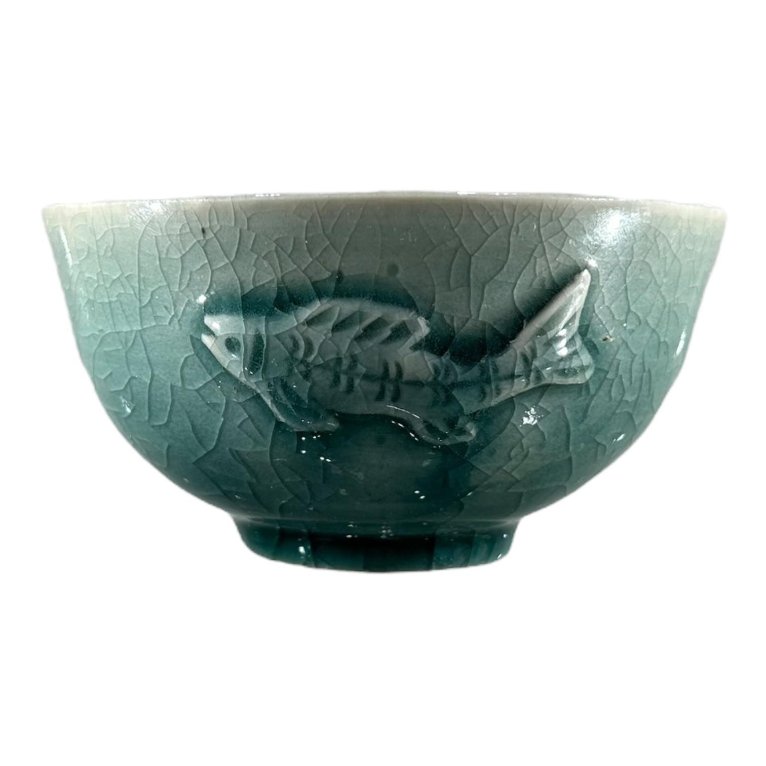 A 20TH CENTURY STUDIO POTTERY BOWL Celadon glaze, embossed fish decoration, signed indistinctly - Image 2 of 4