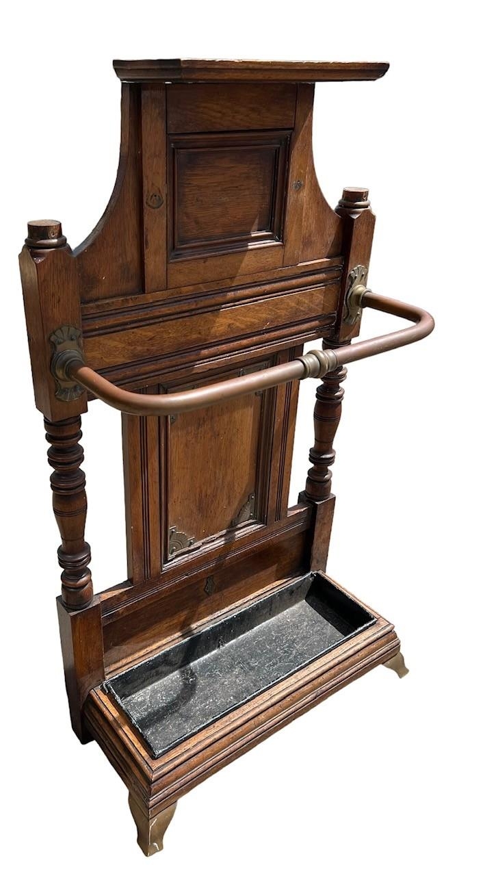 ATTRIBUTED TO JAMES SHOOLBRED & CO., A VICTORIAN BRASS MOUNTED OAK STICK STAND The top tier with - Image 2 of 4