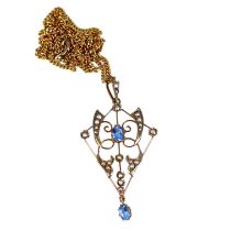 AN EDWARDIAN 9CT ART NOUVEAU, AQUAMARINE AND SEED PEARL PENDANT Attached with a 18ct yellow gold