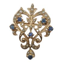 A 9CT GOLD, SEED PEARL AND BLUE SPINEL BROOCH/PENDANT IN THE VICTORIAN ART NOUVEAU STYLE Having