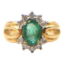 A VINTAGE 9CT GOLD, EMERALD AND DIAMOND RING Having central oval cut emerald (approx 8mm x 6mm) with