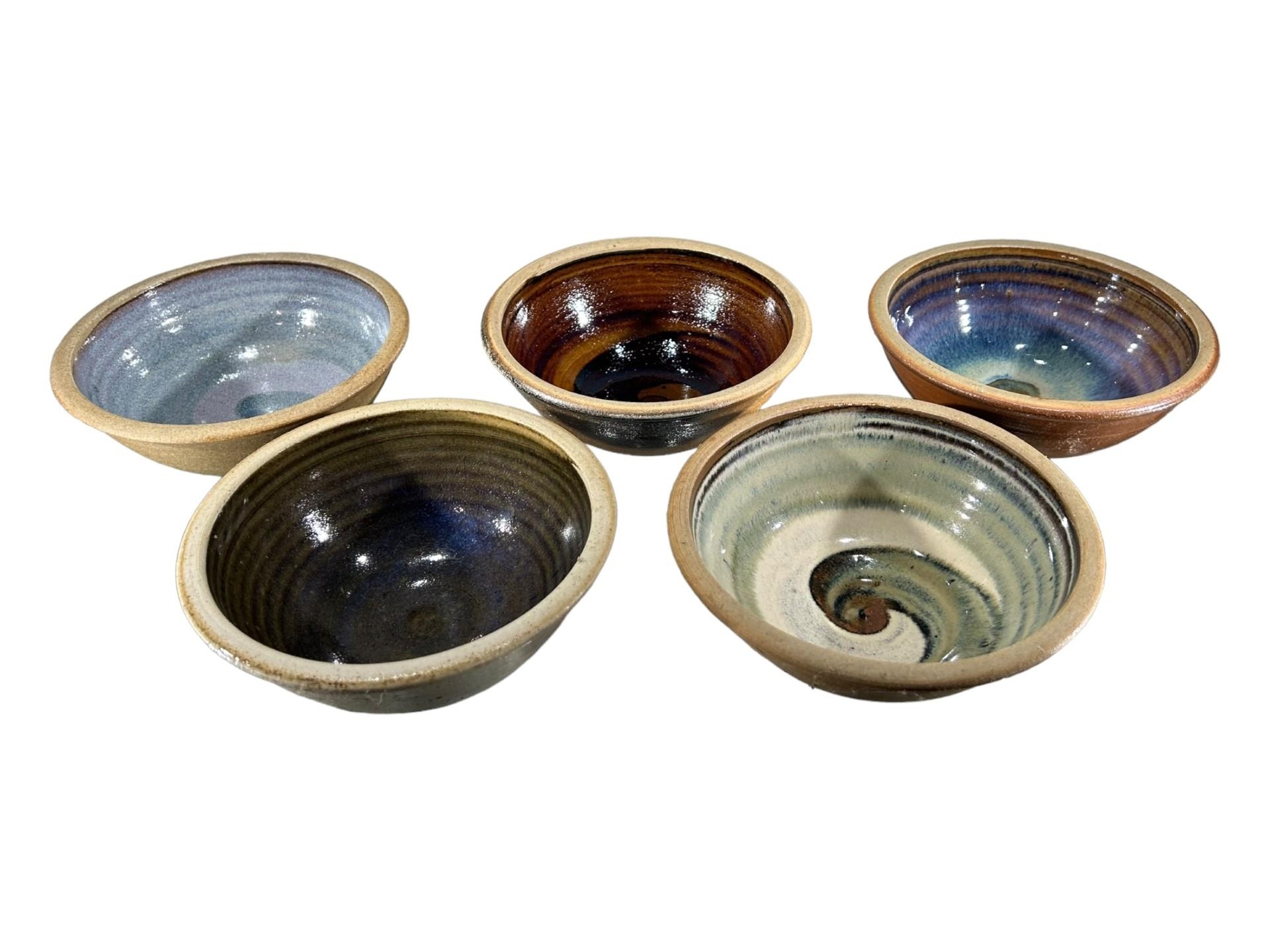 A COLLECTION OF FIVE CERAMICS FESTIVAL STUDIO POTTERY STONEWARE BOWLS, DATED 2001, TWO 2003, 2005