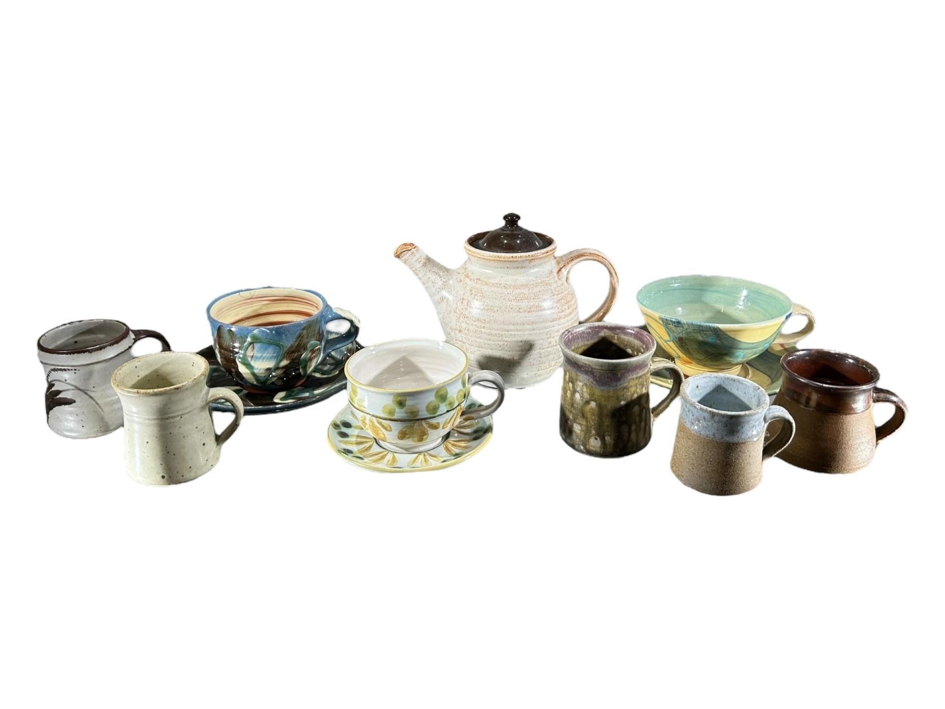 A COLLECTION OF 20TH CENTURY STUDIO POTTERY STONEWARE ITEMS Comprising a teapot, three large cups