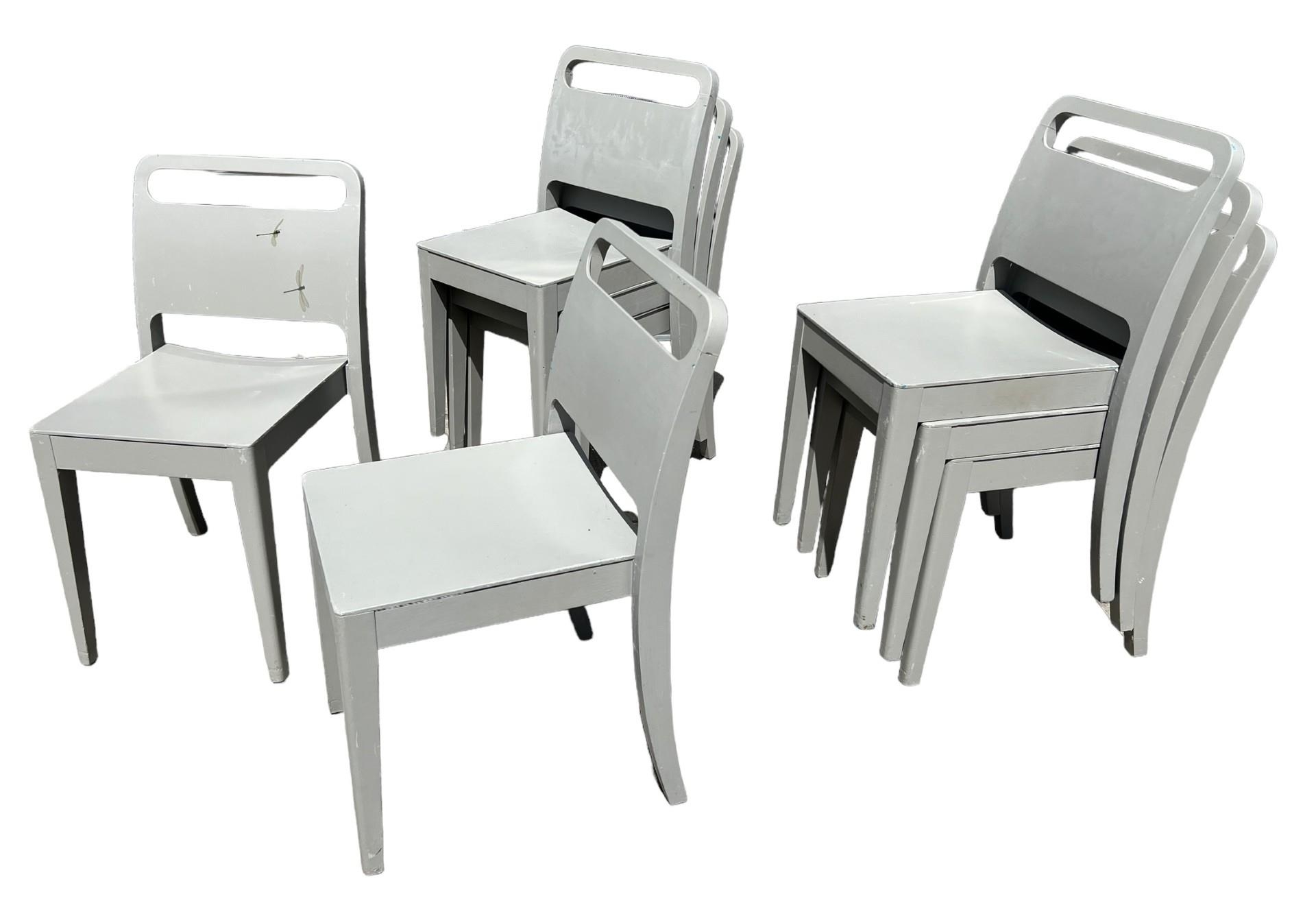 A SET OF EIGHT PAINTED DESIGNER STACKING CHAIRS.